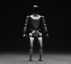 Fourier GR-2 humanoid robot with dual arms, walking on two legs, performing smart object grasping