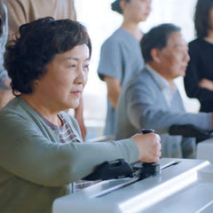 LineMotus L1 intelligent upper limb training robot in use by elderly patient